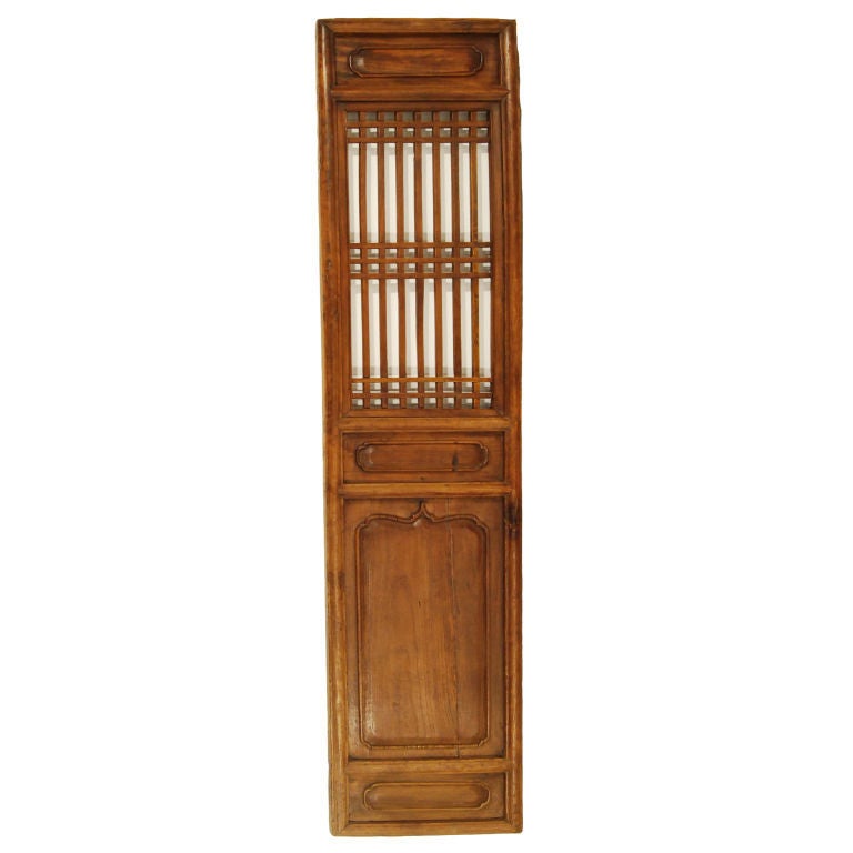 A set of eight 19th century Chinese elmwood courtyard panels with lattice window uppers.