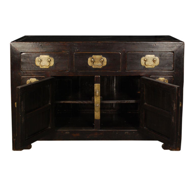 A 19th century Chinese elmwood coffer with five drawers, two doors, and brass hardware.<br />
<br />
Pagoda Red Collection #:  ZZZ092<br />
<br />
<br />
Keywords:  Coffer. sideboard, buffet, server, credenza, console table, sofa table