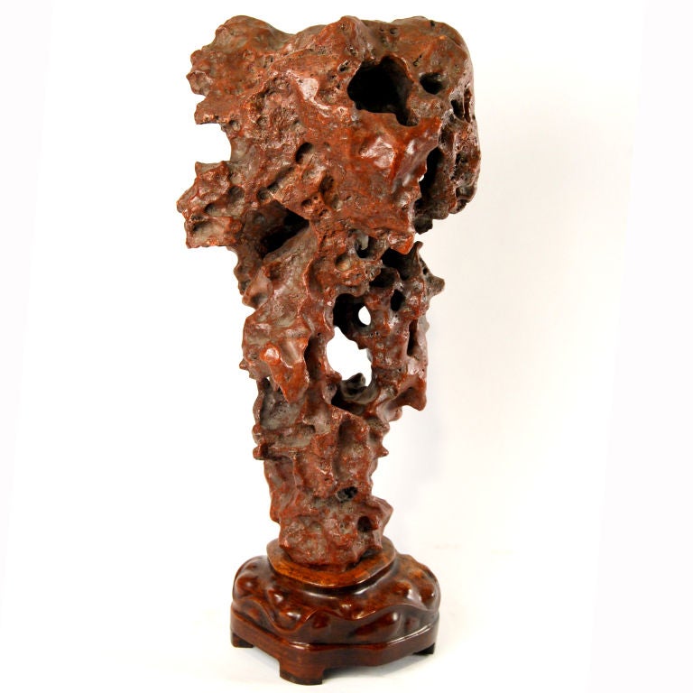 A 19th century Chinese limstone scholars' rock with carved Huali stand.<br />
<br />
Pagoda Red Collection #:  GDD043<br />
<br />
<br />
Keywords:  Stone, sculpture, statue