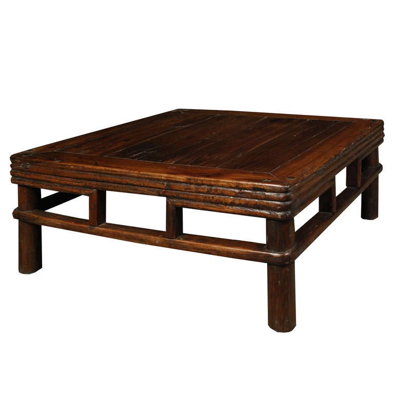 A Chinese Northern Elm square low table with a lovely apron detail and stretchers.

Pagoda Red Collection # CAW003