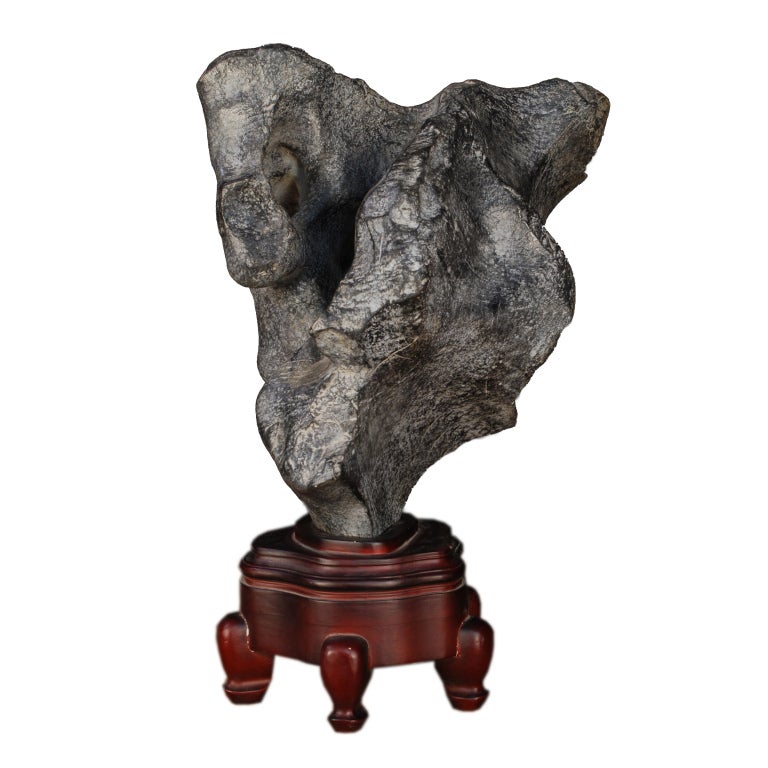 A 19th century Chinese lingbi scholars' stone in a carved wood stand.

Pagoda Red Collection #:  ZZZ101P

Keywords:  Scholars' stone, meditation, lingbi, suiseki stone, Japan, China, sculpture, statue