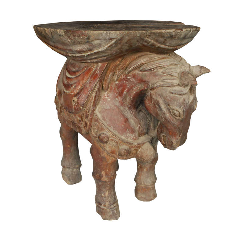 A lovely carved horse stool from Zhejiang Province, China. This camphor stool from c. 1900 would also work great as a side table.

Pagoda Red Collection # BJC053