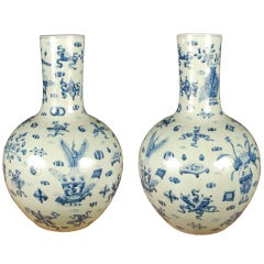 Pair of Blue and White Bottle Vases with Scholars' Objects