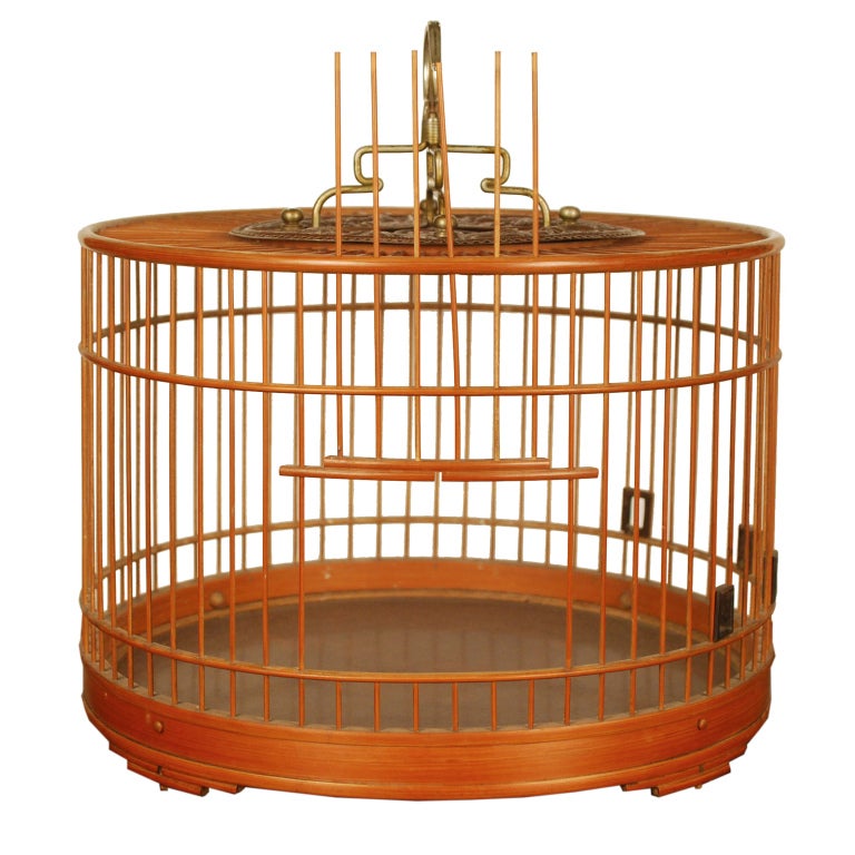 A 19th century Chinese bamboo birdcage with incised copper panel depicting auspicious dragons and bats, with a brass hook.

Pagoda Red Collection #:  M106

Keywords:  birdcage, bird cage, China, Chinese Japan