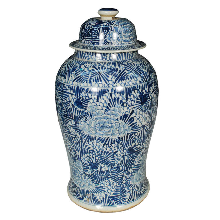 A pair of blue and white ginger jars with a floral pattern depicting chrysanthemums. These jars are hand painted from Southern China.

Pagoda Red Collection # BJC009
