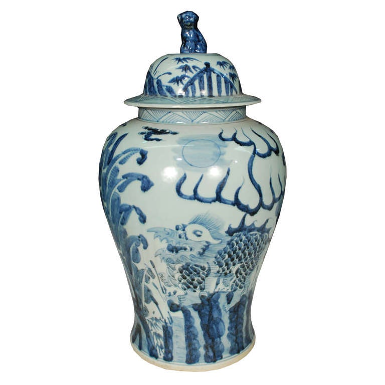 A pair of hand-painted blue and white jars from Southern China. These ceramic jars are painted with the mythical Qilin. They also feature lids topped with fu dogs.

Pagoda Red Collection # BJC059
