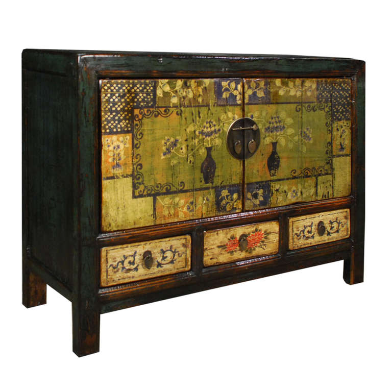 A painted chest from Northern China. This pine chest has been painted with various floral motifs and has two doors and three drawers. The interior includes one shelf.

Pagoda Red Collection 