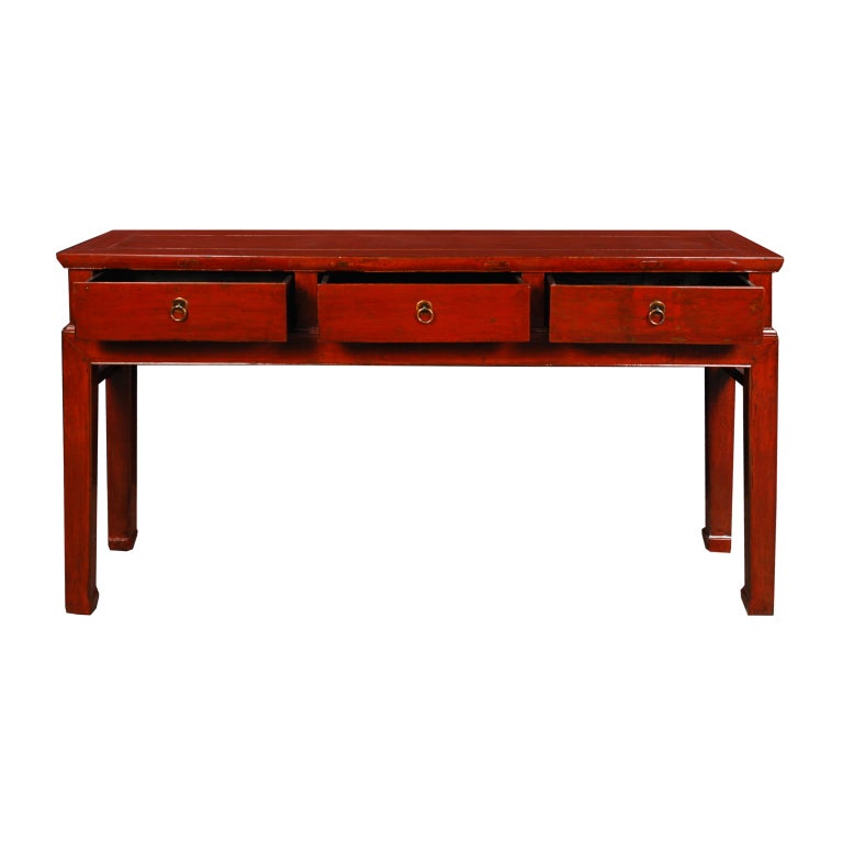A 19th century Chinese red lacquered elmwood table with three drawers and legs ending in hoof feet.

Pagoda Red Collection #:  CAI078


Keywords:  Table, console, sofa table, sideboard, server, credezna, buffet