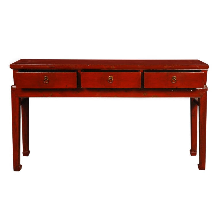 An early 20th century Chinese red lacquered altar table with three drawers, brass hardware, and tapered legs ending in hoof feet.

Pagoda Red Collection #:  CAI081

Keywords:  Table, console, sideboard, buffet, server, credenza, sofa table