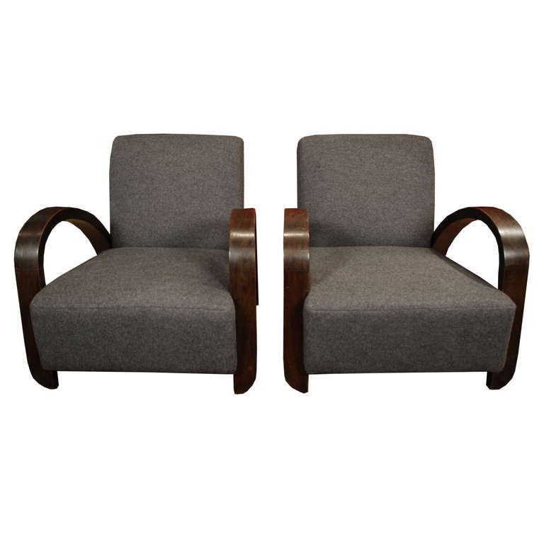 A pair of lovely deco chairs from Shanghai, China. These 1930's chairs are made of Teak and feature beautiful wool upholstery.

Pagoda Red Collection # ACB020