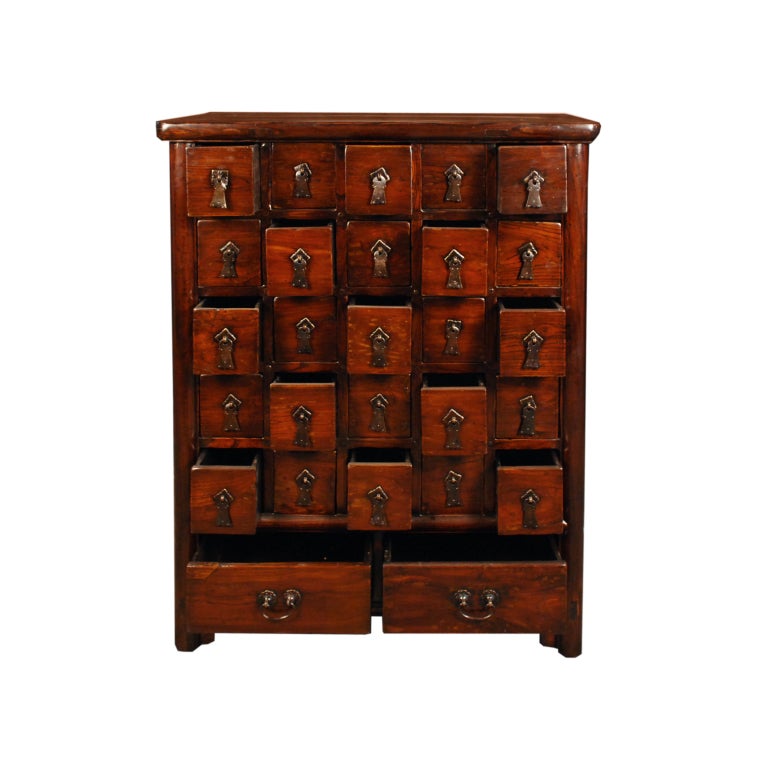 A 19th century Chinese elmwood apotehcary chest with 27 drawers and brass hardware.

Pagoda Red Collection #:  CAI018


Keywords:  Chest of drawers, cabinet, console, side table