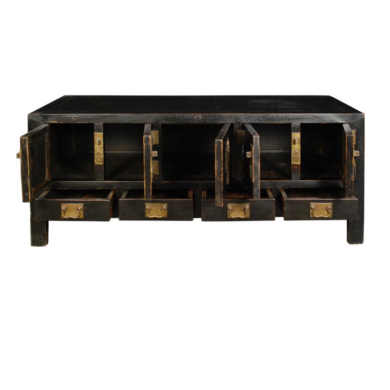 A 19th century Chinese Kang chest with four drawers, four doors and a hidden compartment in the center, with brass hardware.

Pagoda Red Collection #:  DVD019


Keywords:  Low chest, media, console, sofa table, sideboard, buffet, server,