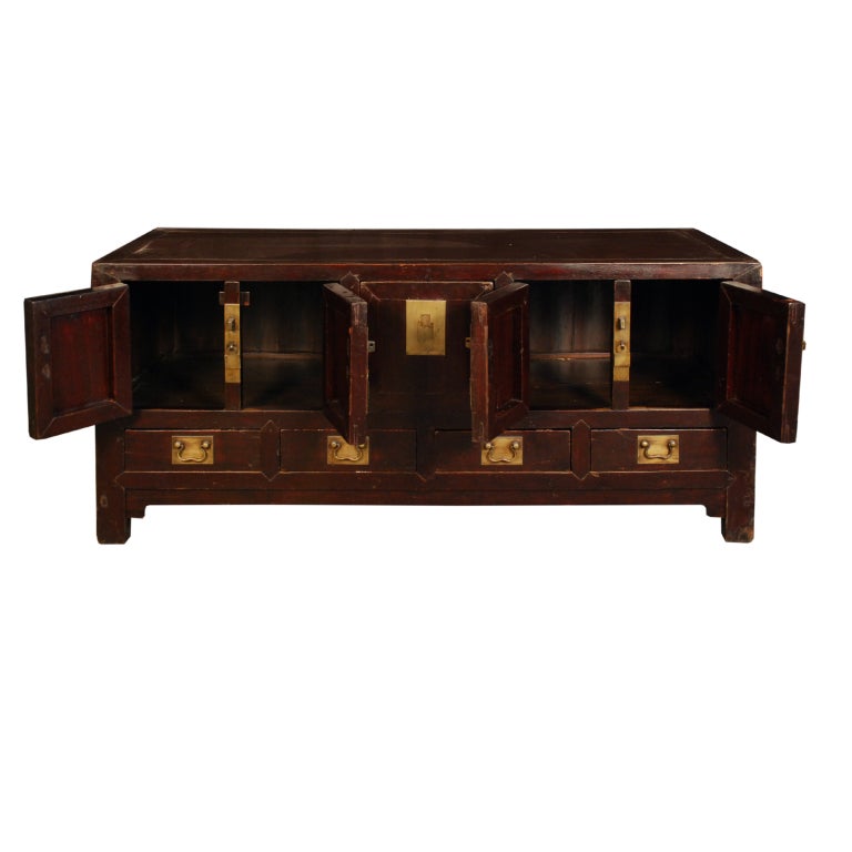 A 19th century Chinese kang (low) cabinet with four doors, four drawers, and one locking panel in the center, with brass hardware.

Pagoda Red Collection #:  DVD038

Keywords:  Chest, low, media, sideboard, buffet, server, credenza, dresser
