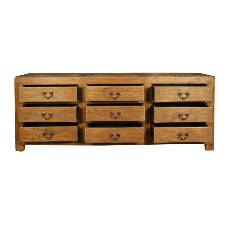 A 19th century Chinese elmwood apothecary chest with nine drawers and brass hardware.

Pagoda Red Collection #:  DVDD017


Keywords:  Chest of drawers, dresser, commode, sideboard, buffet, server, credenza, console table, sofa table