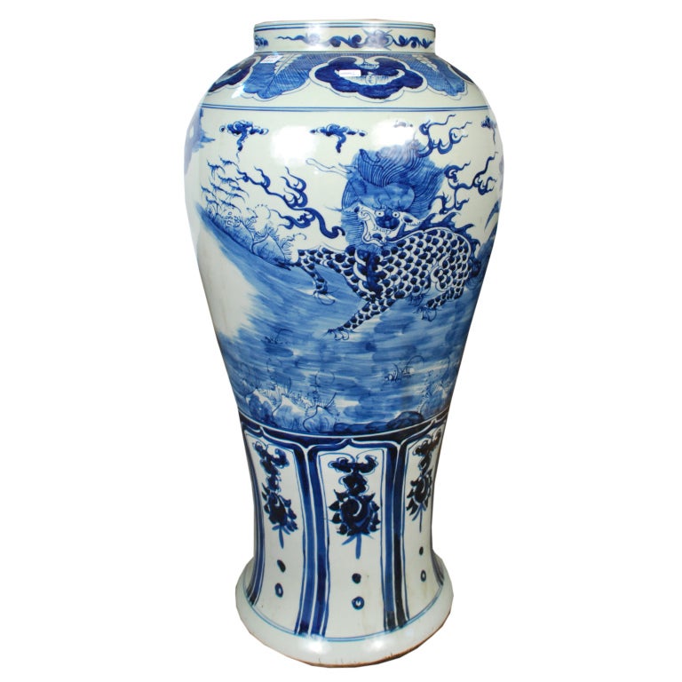 A 20th century Chinese blue and white porcelain baluster-form ginger jar painted with mythical Qilin figures in a garden landscape, with a Fu dog mounted lid

Pagoda Red Collection #:  BJAA088B

Keywords:  Jar, vase, urn, vessel, jardiniere