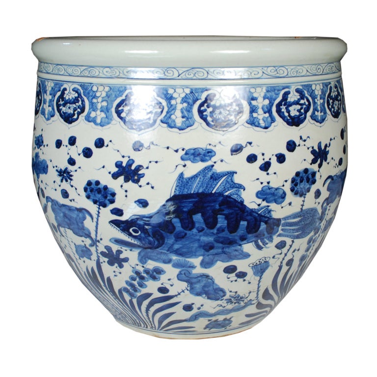 An early 20th century Chinese blue and white underglazed porcelain fish bowl painted with fish, lotus pods, and underwater plants.

Pagoda Red Collection #:  BJAA092B


Keywords:  Bowl, vase, platner, jardiniere, urn, vessel, garden