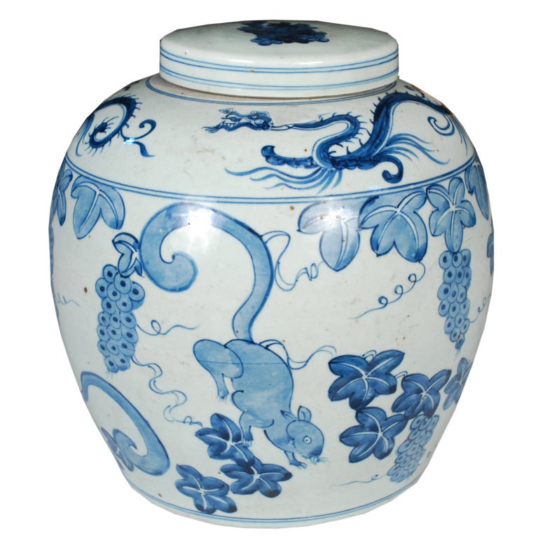 A 20th century Chinese blue and white porcelain ginger jar painted with squirrels playing amidst grape vines, with swirling dragons around the top.

Pagoda Red Collection #:  BJAA098C

Keywords:  Jar, urn, vase, vessel, pot