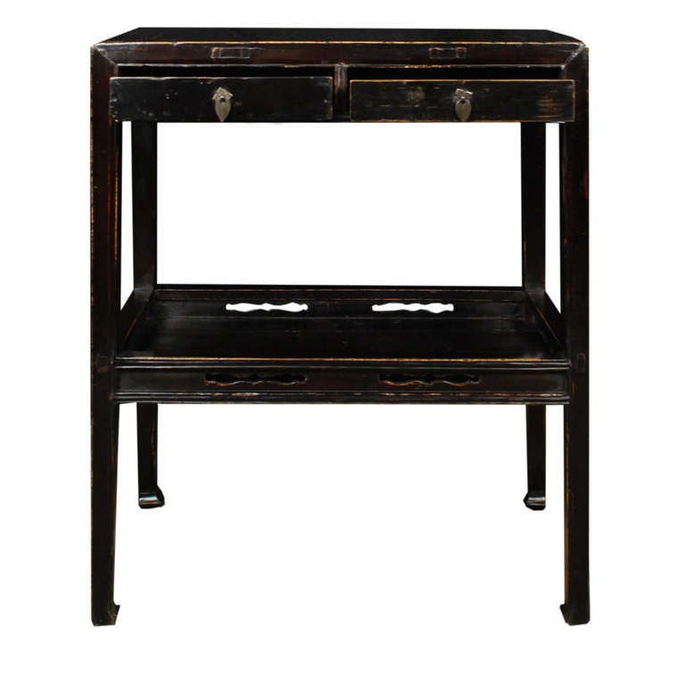 A petite table with two drawers and a shelf. This c. 1800 table is from Shanxi Province, China and is made of Elmwood.

Pagoda Red Collection # BJB030