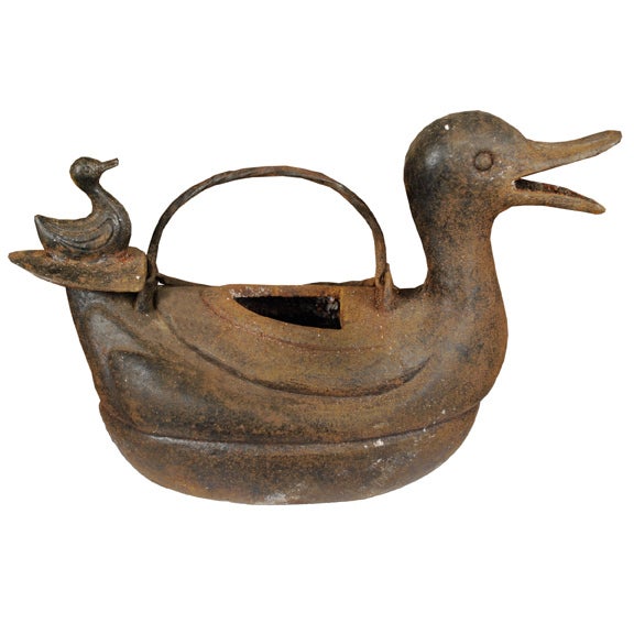 An early 20th century Chinese cast iron water kettle in the form of a duck with open mouth.

Pagoda Red Collection #:  BJAA040


Keywords:  Sculpture, Statue, teapot, water kettle, pot