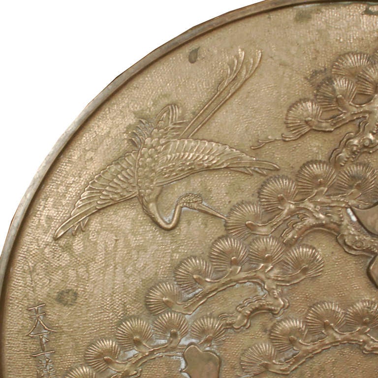 A 19th century Japanese hand mirror with pine tree, crane, and characters in relief, mounted on custom steel stand.

Pagoda Red Collection #:  HIK004B

Keywords:  Mirror, bronze, sculpture, statue, Asian, China, Chinese