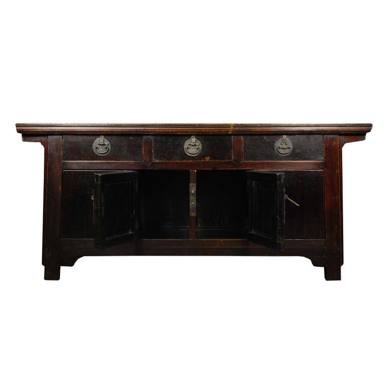 An elmwood coffer from Beijing, China. This c. 1900 pieces features three drawers and two bi-folding doors, all with brass hardware.

Pagoda Red Collection # BJB099