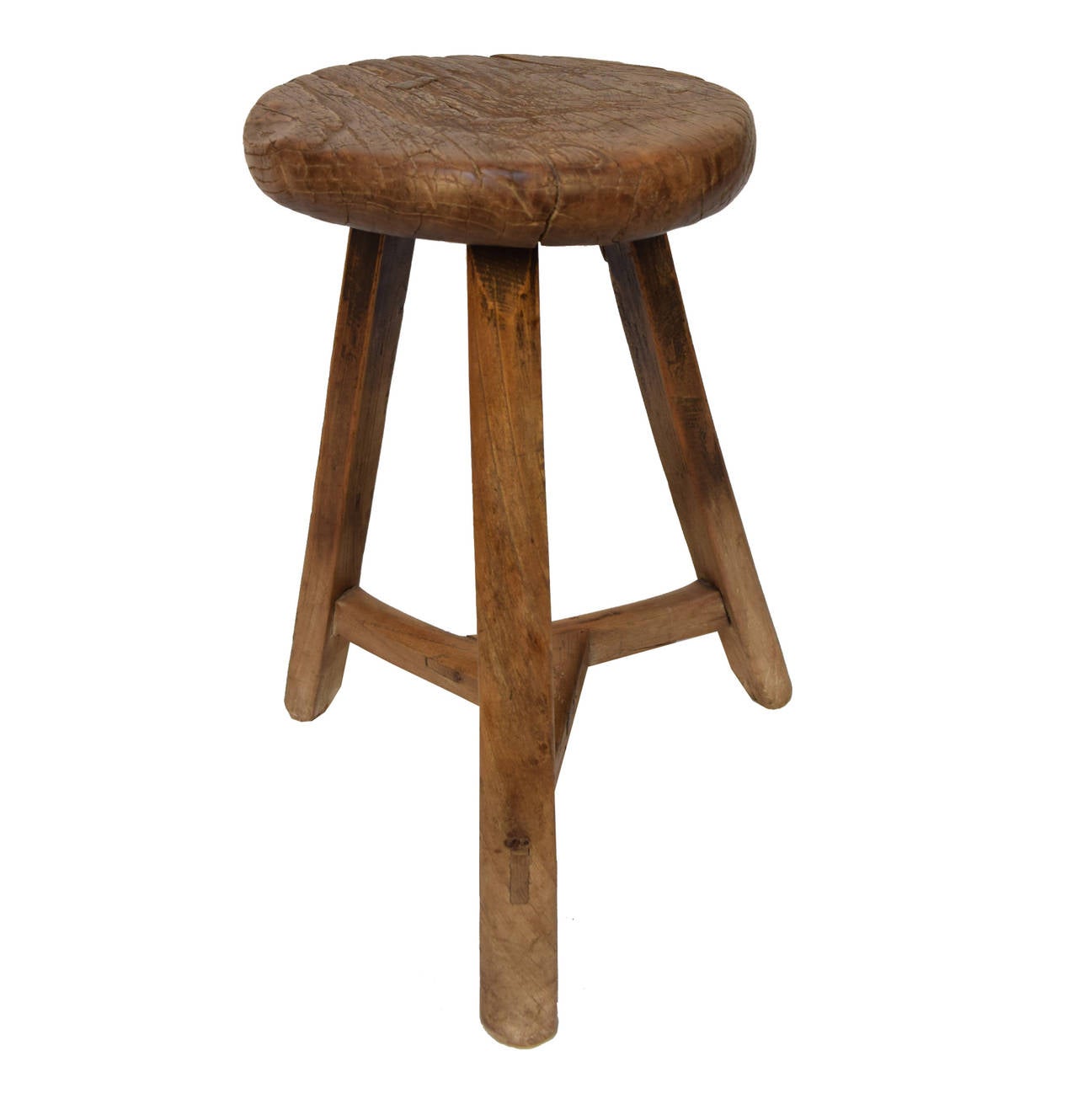 A round top stool from Northern China made of Chinese Northern Elm from, circa 1850 with three legs.