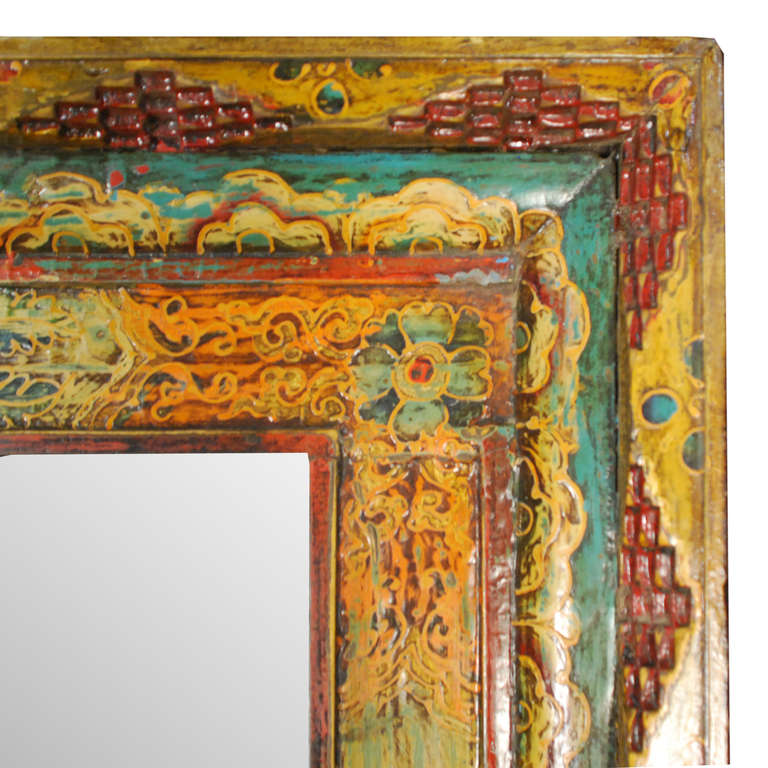 A wonderfully painted mirror from Tibet. The grande pine frame is painted in a floral motif of green, yellow, and red.

Pagoda Red Collection # DVEE020