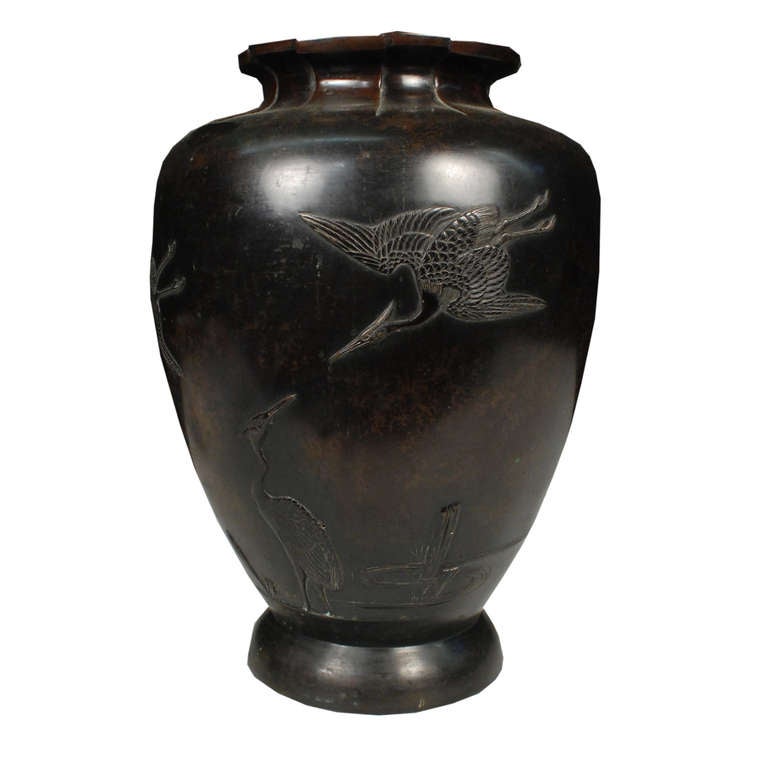 A bronze baluster form urn from Japan. This urn is from c. 1900 and depicts a scene of cranes.

Pagoda Red Collection # CMK015