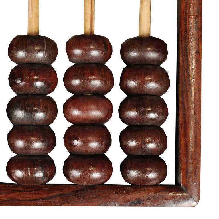 A 19th century Chinese rosewood abacus with white brass mounts.

Pagoda Red Collection #:  P186A

Keywords:  China, Chinese, sculpture, statue, object, scholars