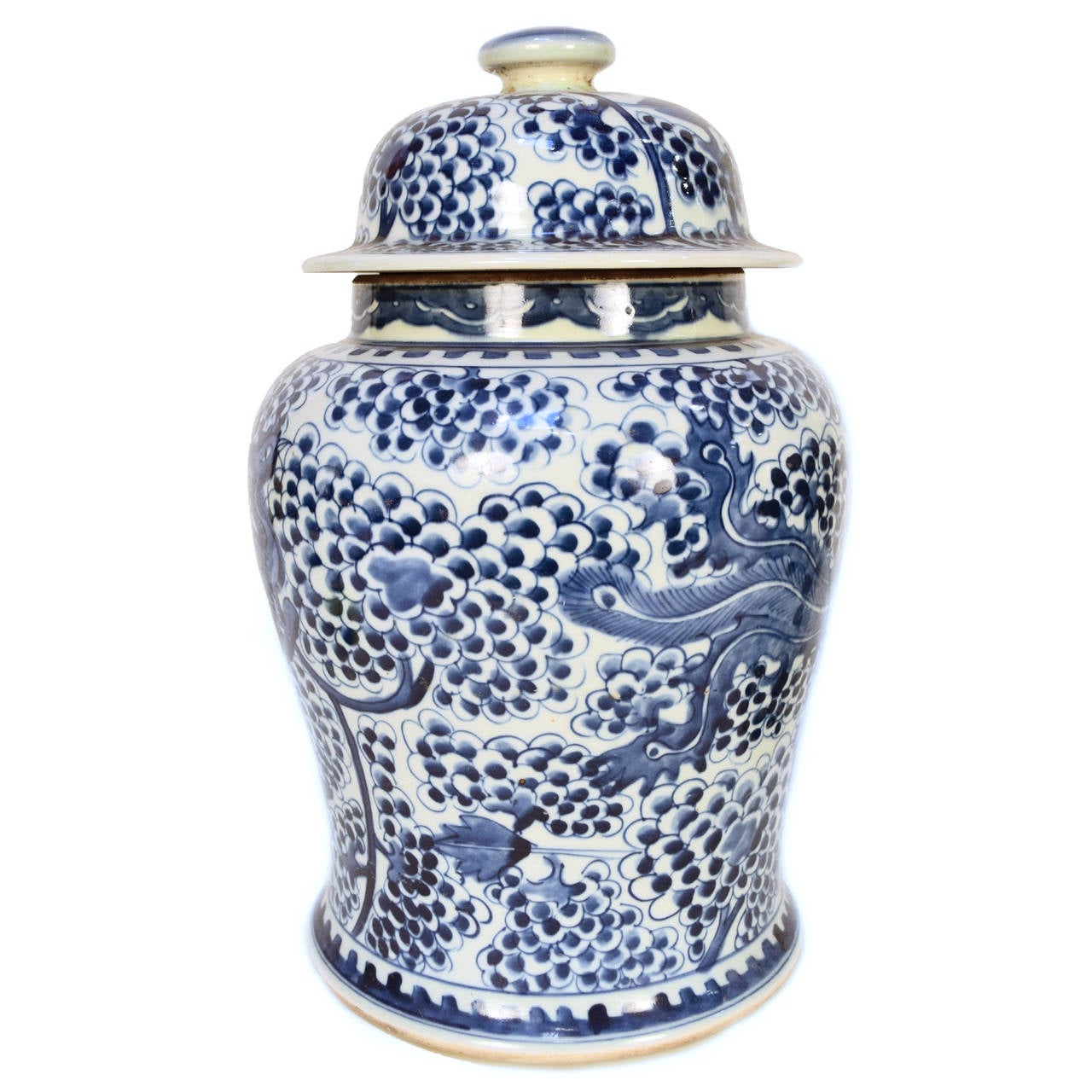Porcelain covered blue and white ginger jar depicting phoenix & fruit on the vine. The Phoenix, also called Fenghuang or 