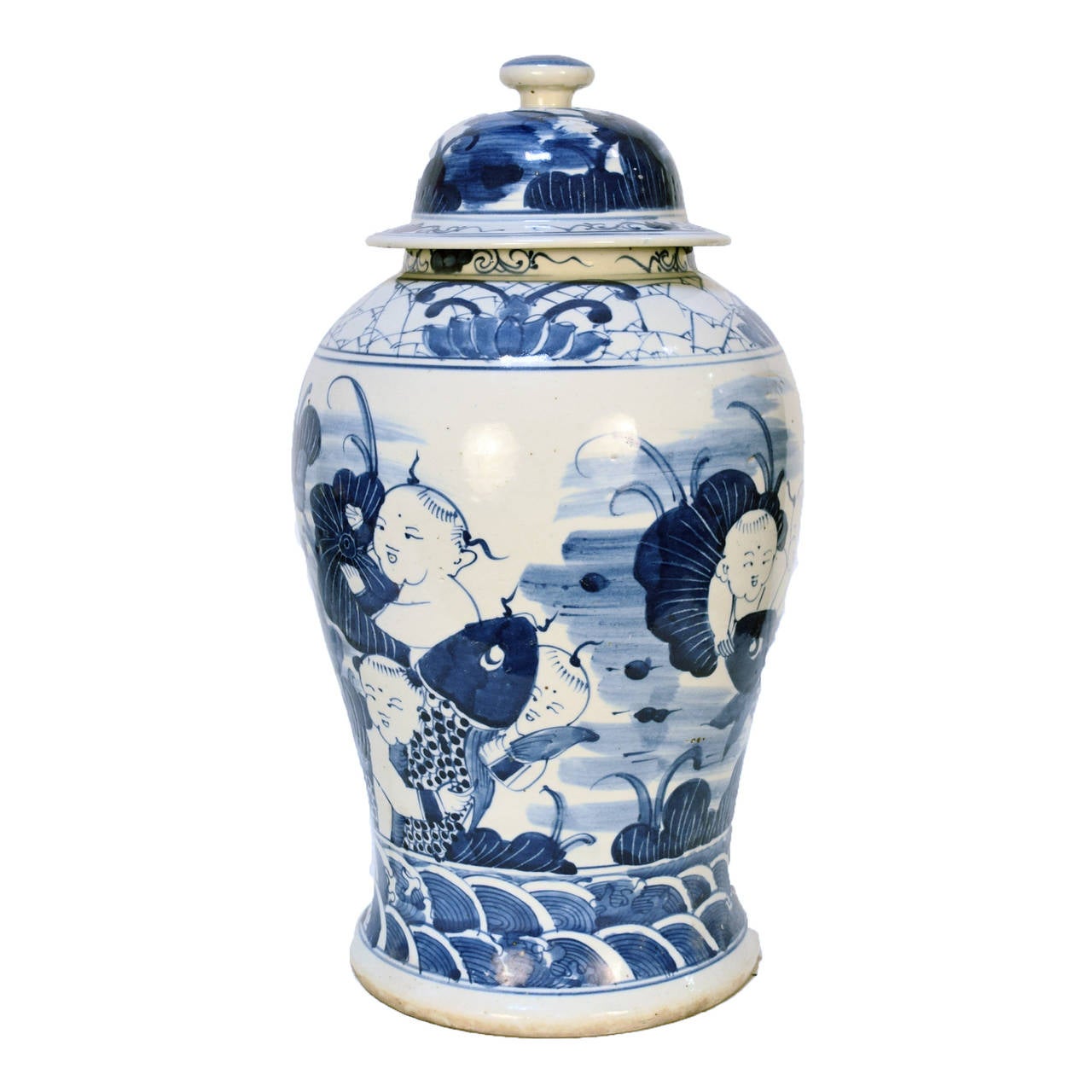A blue and white ginger jars from Jiangxi Province, China painted with lucky babies and fish with a wave pattern along the base.