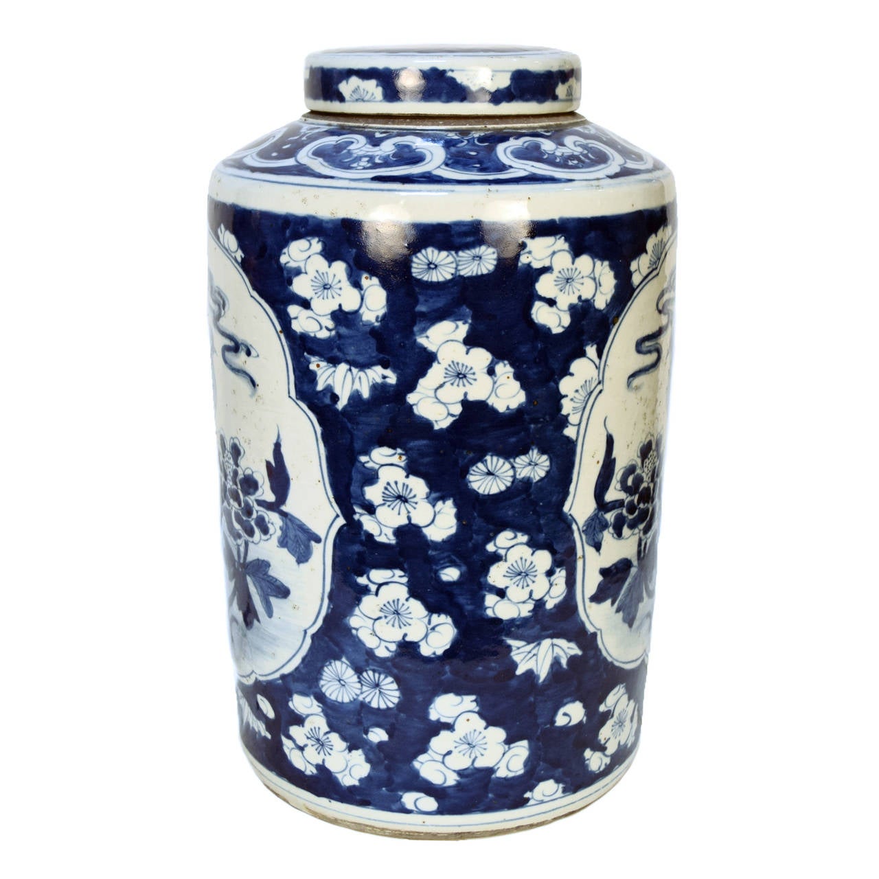 A blue and white tea leaf jar with lid featuring a Phoenix motif from Beijing, China.