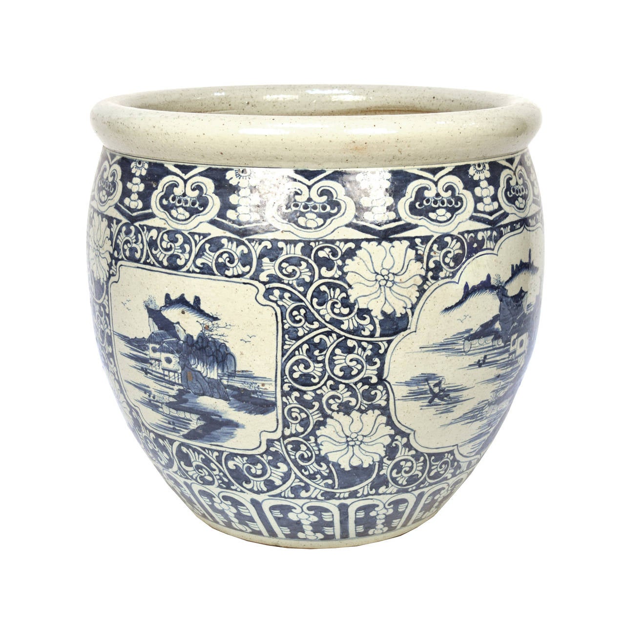 Blue and white porcelain fish bowl painted with a traditional river and mountain landscape scene.