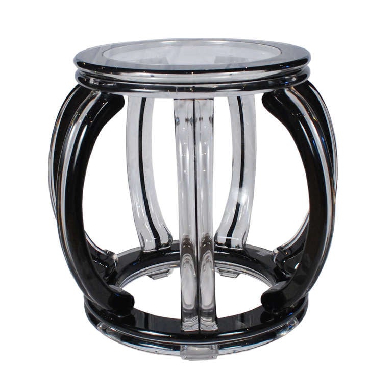 Each limited edition lucite Mirage Stool, hand-made by artist July Zhou, is
fashioned after a traditional Ming example. Unlike other lucite
furniture that is injection molded, Mr. July's work is created by
skilled artisans who thermoform,