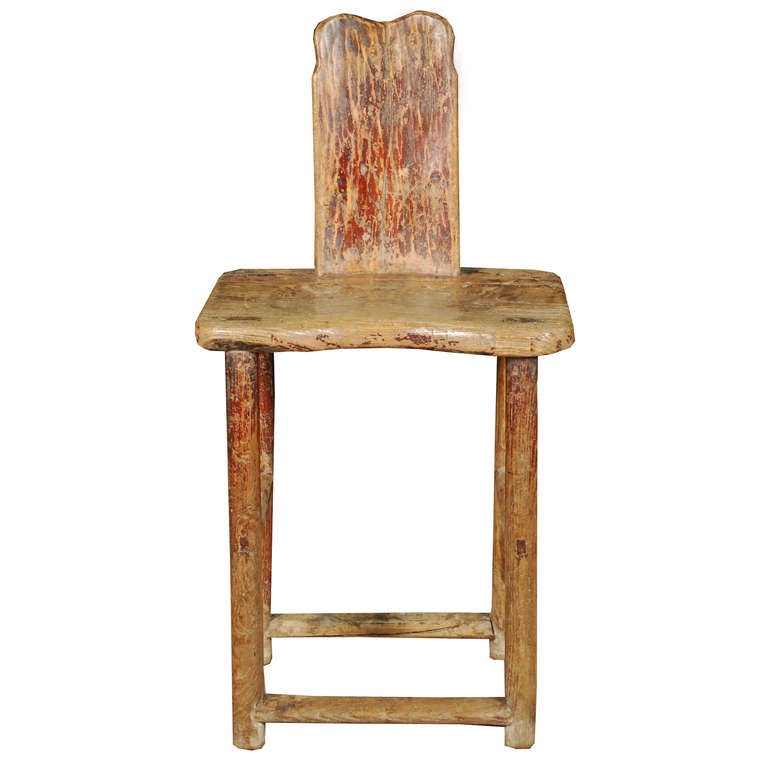 An early 20th century provincial Chinese Elmwood chair with simple back splat and well worn patina.

Pagoda Red Collection #:  BJB041

Keywords:  Chair, stool, bench, side, desk chair, slipper, vanity chair