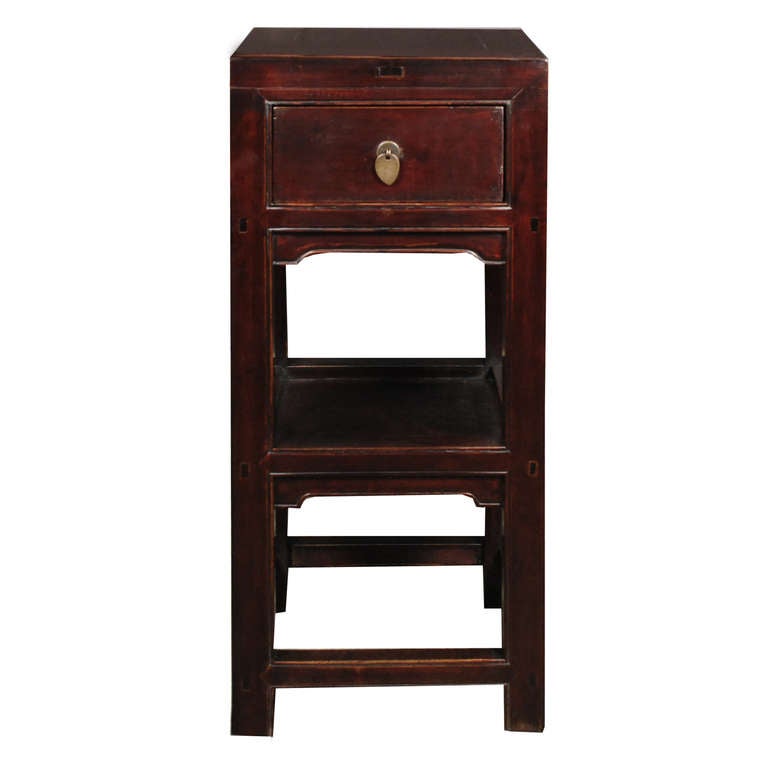 A pair of 19th century Chinese elmwood tea tables, each with one drawer and a shelf.