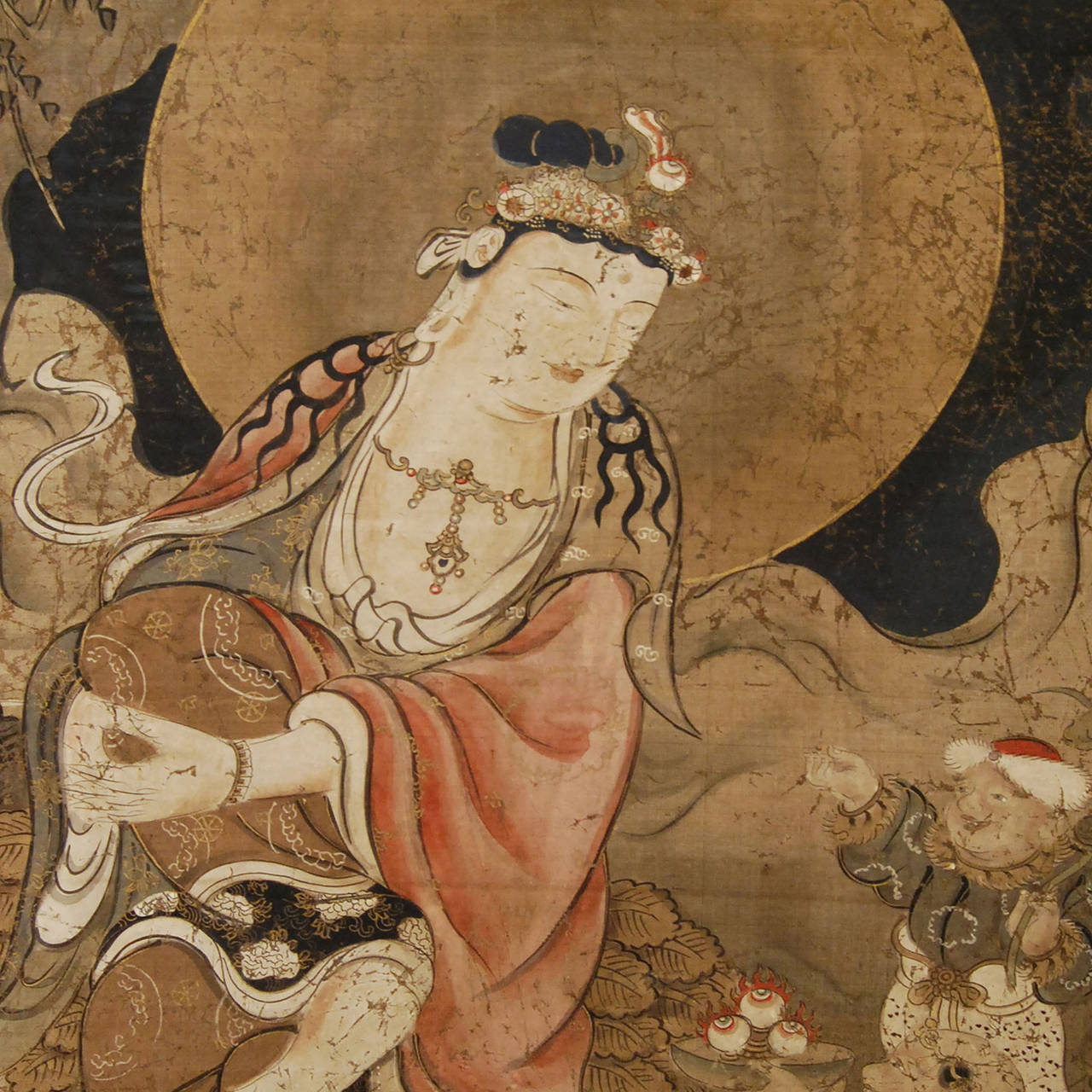 18th Century Japanese Buddhist Scroll Painting of a full moon Guanyin with children attendants in a celestial setting. Mounted with gilt copper.