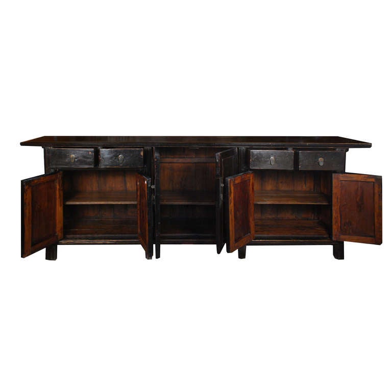 A 19th century Chinese elmwood six-door, four-drawer coffer with brass hardware and well-worn patina.

Pagoda Red Collection #:  BJB056

Keywords:  Sideboard, coffer, buffet, server, credenza, console table, sofa table