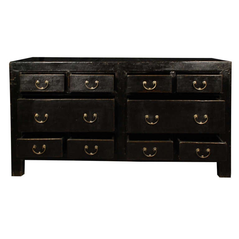 A chest from Shanxi province, China. This Chinese Northern elmwood chest is from circa 1850 and features ten drawers, each with brass pulls.

