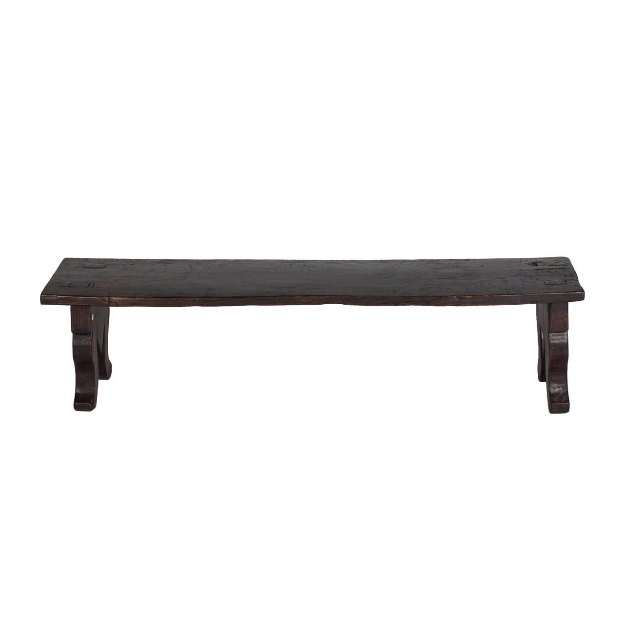 Yumu Primitive bench with carved side panel that reference the shape of an elephants' trunks.