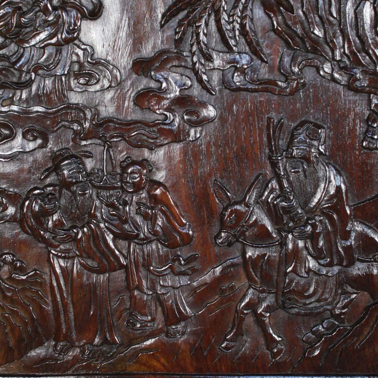 A set of six 19th century exquisitely carved rosewood (huali) panels depicting multiple Buddhist gods and goddesses amidst forest landscapes, turbulent waves, and clouds.  Carved with dragons and Shou characters on the reverse.