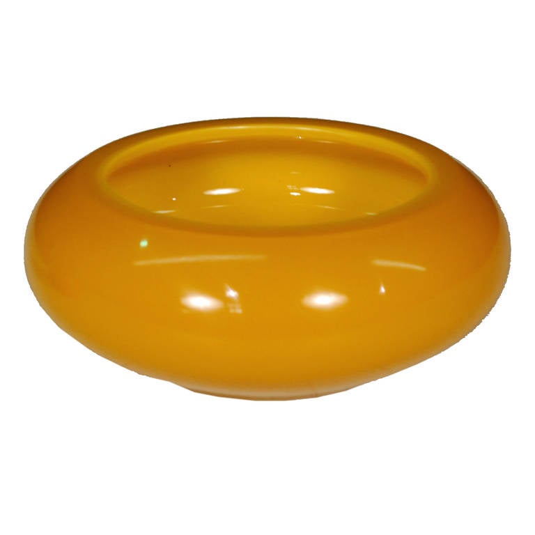 A splendid Peking glass bowl from Beijing, China. This bowl is a rich goldenrod color and is from circa 1900.

    