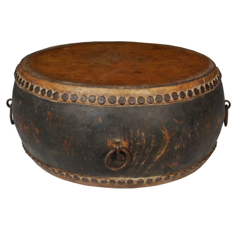 A hide and wood drum from Beijing, China. This circa 1900 drum also features brass hardware.

    