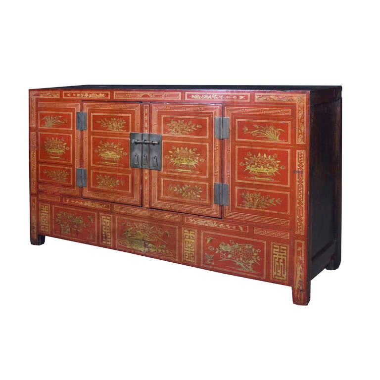 A fantastic gilt and red lacquer coffer from Hebei province, China. This wedding piece is red as a symbol of prosperity and good luck. A chest like this was often the centerpiece of a bride's dowry. This piece features two doors the open to a large