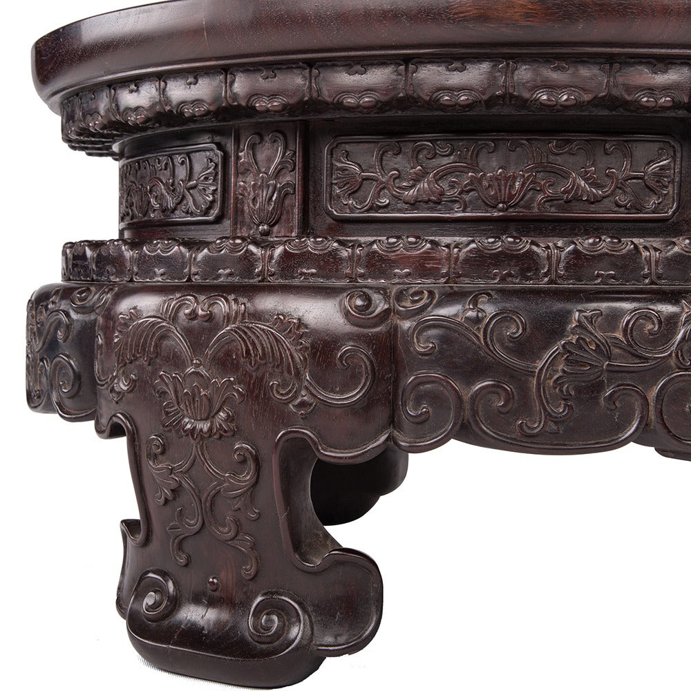 Pair of vintage Zitan display stands with lotus and vine relief carved pattern, with ruyi feet.