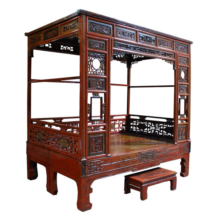 A wonderful red canopy bed from Northern China. This bed is made of Chinese Northern Elm and has intricate lattice patterns and carvings. 

Pagoda Red Collection # CMH606