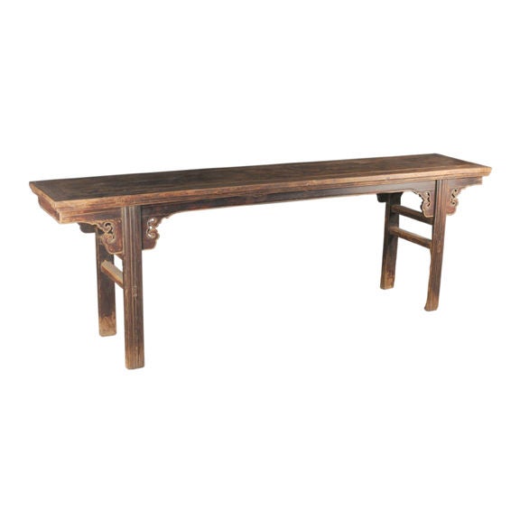 Remarkable for its intricate carving, this splendid example of Ming dynasty artistry is crafted of cypress wood, prized for its warm brown color and wonderful feel to the touch. Ringed around the top with carved beading, the altar table displays