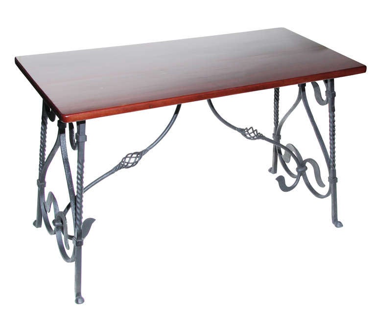 This is an interesting table and bench set. The iron work is very well done and the wood is rich. The table measures 29 inches tall x 23.5 inches wide x 47.75 inches in length.
The benches are 18 inches tall x 10 inches wide x 47.5 inches long. The