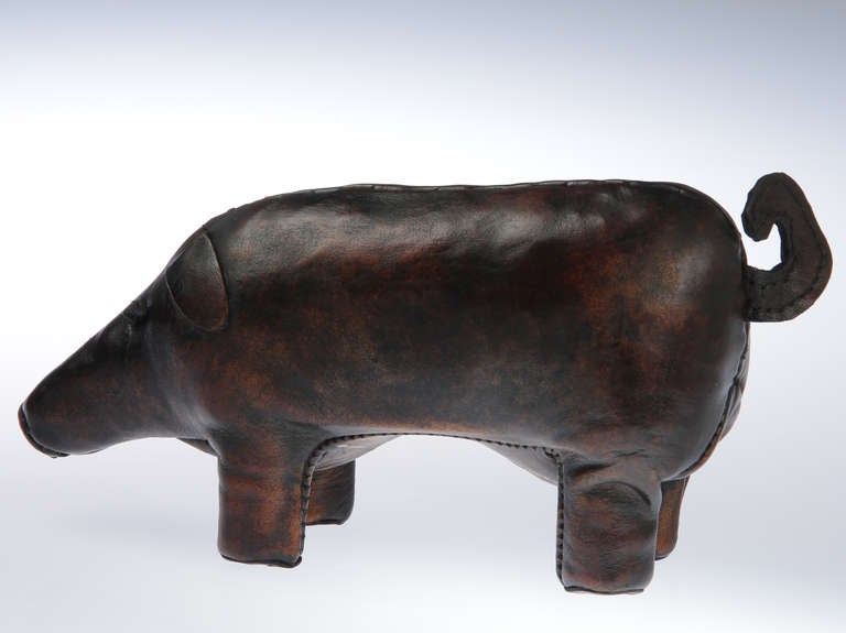 This is an adorable,small leather pig signed Valenti.
Valenti, a Spanish studio, worked between 1901 and 1930 and the pieces are very similar to those done by Abercrombie and Fitch.