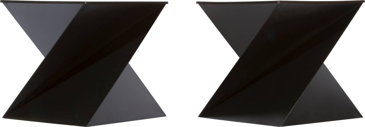 These interesting tables have an origami feel to their construction. Enameled steel in a matte black lacquer.